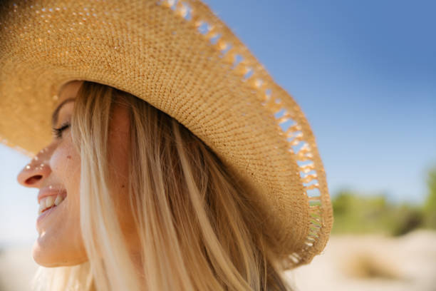 istock Happy woman at the beach 2197983909