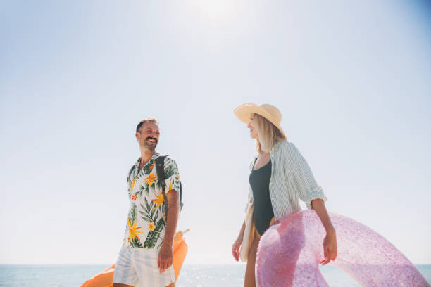 istock Couple having a fun day at the beach 2197983912