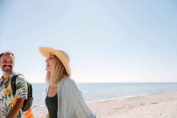 istock Couple having a fun day at the beach 2197983932