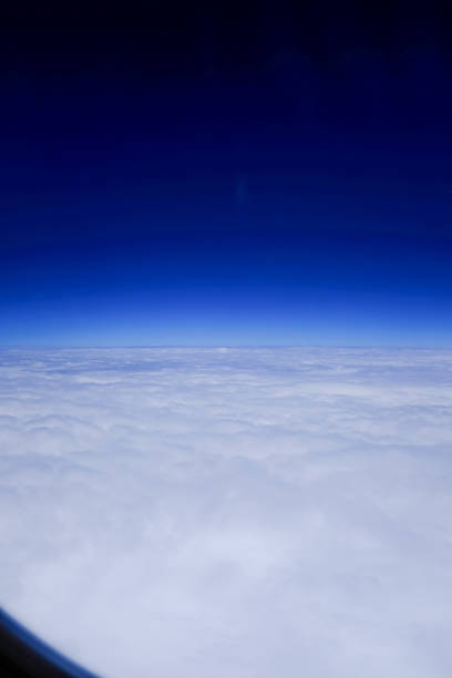 As the sun dips toward the horizon, casting its final rays across the vast expanse of sky, a breathtaking cloudscape unfolds beneath