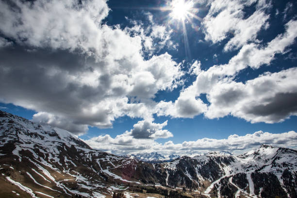 Cloudy sky above Pampeago, Latemar mountain range, Val di Fiemme, Dolomites, Italy.
