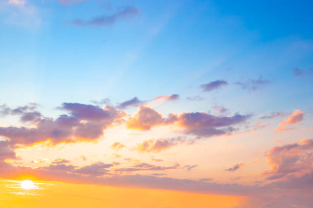istock Blue sky with clouds illuminated by the setting sun. Beautiful skyscape 2197985230