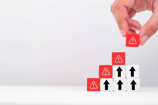 istock A hand stacking blocks with warning symbols, symbolizing risk assessment and management in business environments. 2197987273