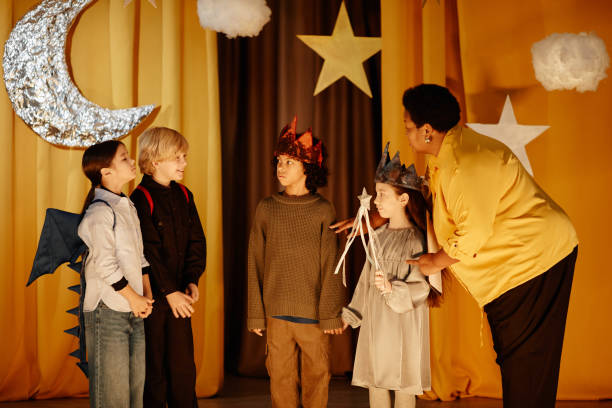 istock Supervising Children Performing in School Play 2197989626