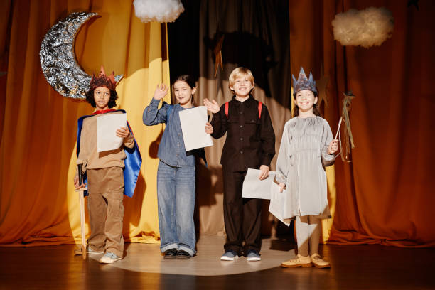 istock Celebrating School Performance on Stage with Friends 2197989695