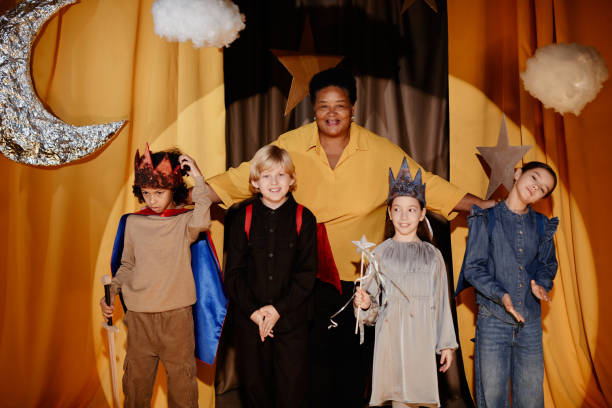 istock Celebrating Children's Performance at School Event with Teacher 2197989704