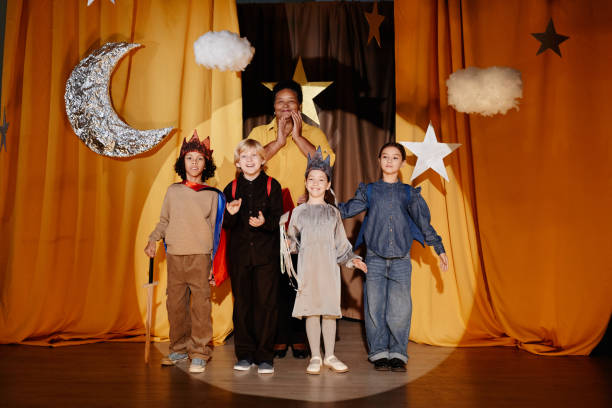 istock Performing School Play With Children on Stage Grinning 2197989724