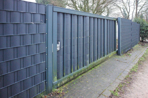istock Modern metal fence with vertical panels 2197990110