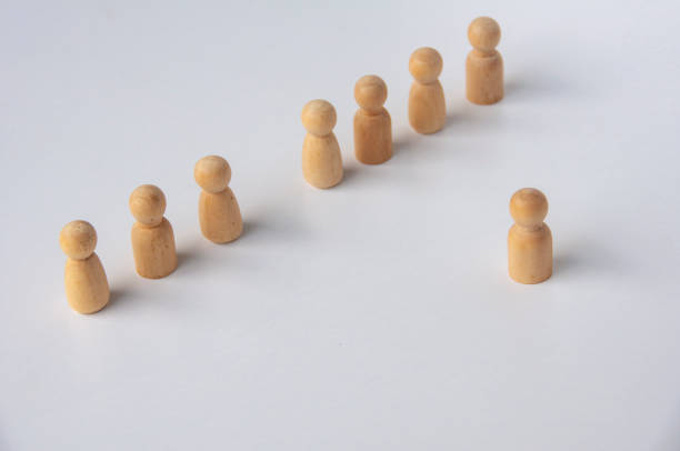istock A wooden figure stepping out to lead other figures with customizable space for text. Leadership concept 2197991206