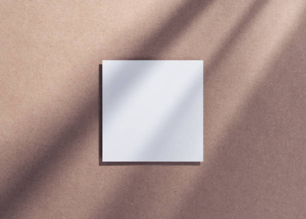 istock Blank square paper mockup with gobo lighting 2197991227