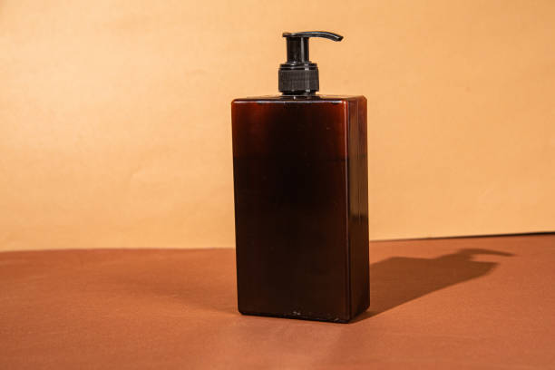 istock Soap dispenser on beige background close up 2197991366