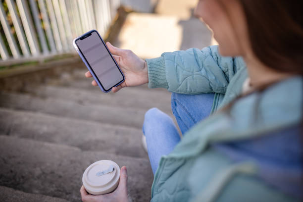 istock Patient enjoys outdoor time while using smartphone and sipping coffee, focusing on wellbeing and connection 2197993016