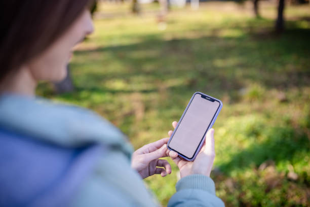 istock Patient enjoys outdoor time while using her smartphone for health and wellness information 2197993312