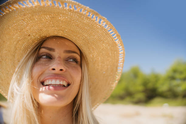 istock Happy woman at the beach 2197994120