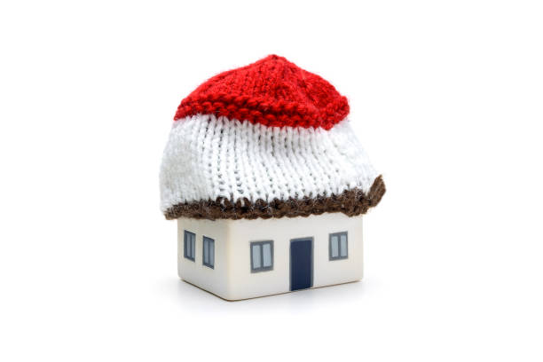 istock House With Red Wool Hat Representing Insulated Home Warmth and Energy Efficiency for Heating Energy Saving and Winter Protection 2197994815