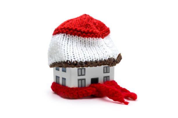istock House With Red Wool Scarf and Hat Representing Insulated Home Warmth and Energy Efficiency for Heating Energy Saving and Winter Protection 2197994821