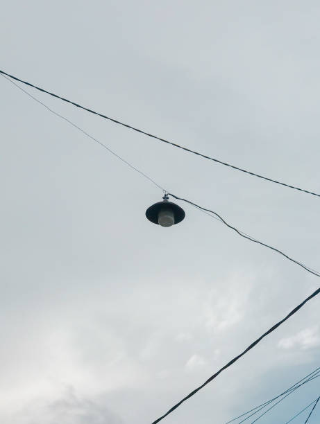 istock street lights with cloudy blue sky background 2197994969