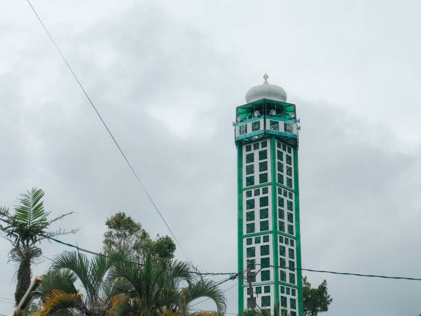 istock Green mosque minaret with blue sky background 2197994976