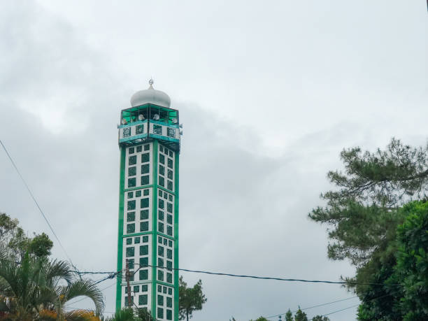 istock Green mosque minaret with blue sky background 2197994997