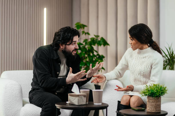 istock A married couple discussing their problems at a counseling session with a psychologist. 2197995904