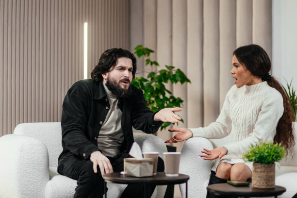istock A couple discussing relationship problems at a counseling session with a family psychologist. 2197995984