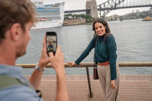 istock Young adults enjoying a weekend in Sydney, Australia while capturing joyful moments by the harbor 2197996482