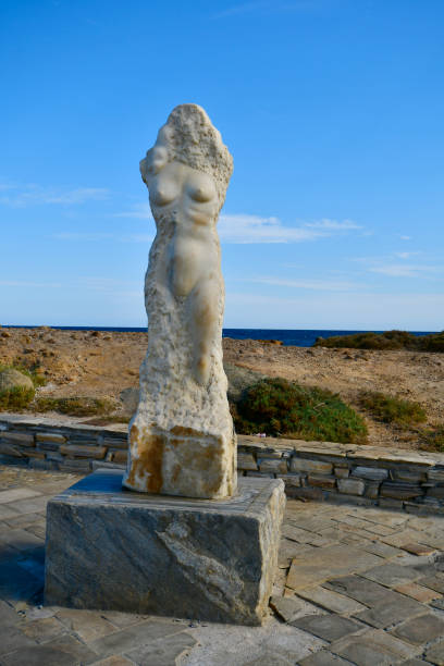 Naxos, Greece - September 20, 2024: The ancient marble statue Ariadne - a love story of Greek mythology with god Dionysus on the causeway to the islet Palatia where the remains of the Apollo temple are