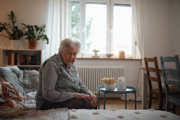 istock Senior woman living alone and feeling lonely. 2197999084