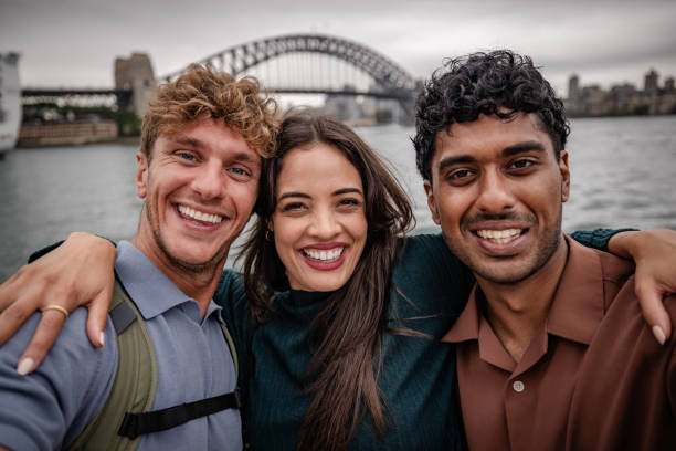 istock Friends enjoying a weekend in Sydney, sharing smiles and laughter by the waterfront 2198001657