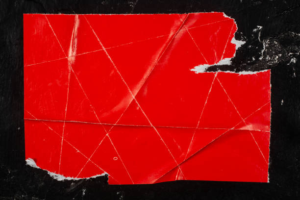 istock Red torn poster. Old poster on a bulletin board. 2198002529