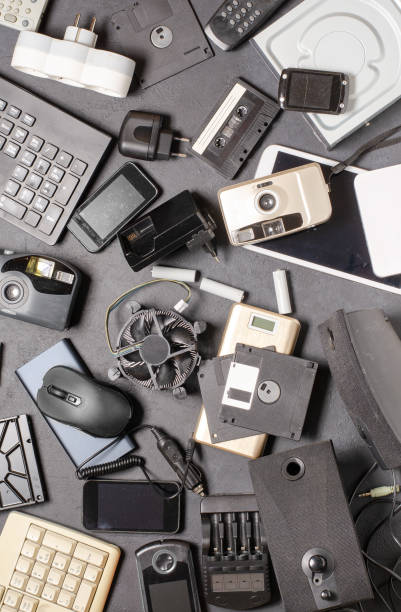 istock Old electronic devices on a black background. The concept of recycling used gadgets. 2198004693