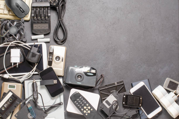 istock Old electronic devices on a black background. The concept of recycling used gadgets. 2198004694