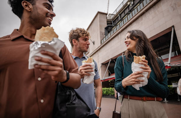 istock Young adults enjoy street food while exploring Sydney on a vibrant weekend day 2198004744
