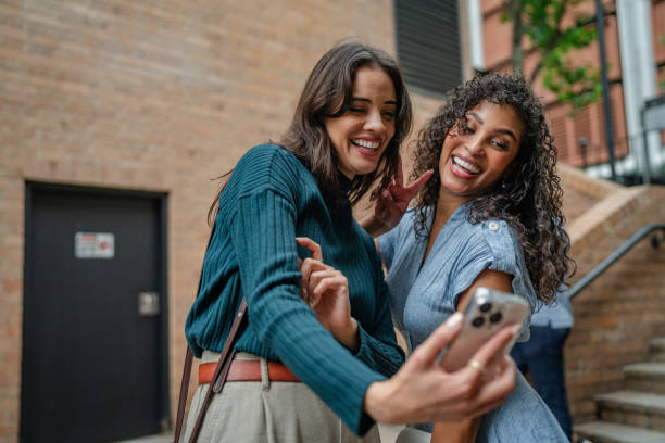 istock Young adults enjoying a joyful moment while taking a selfie in Sydney, Australia on a sunny weekend afternoon 2198005582