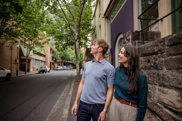 istock Young adults enjoying a leisurely stroll in Sydney's charming streets during a sunny weekend afternoon 2198005665