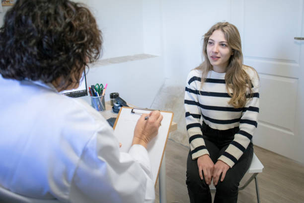 istock Young woman in a doctor's office 2198006323