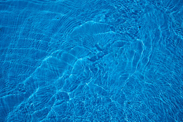 istock Reflecting water wave abstract surface on a sunny day and natural swirl texture 2198007664
