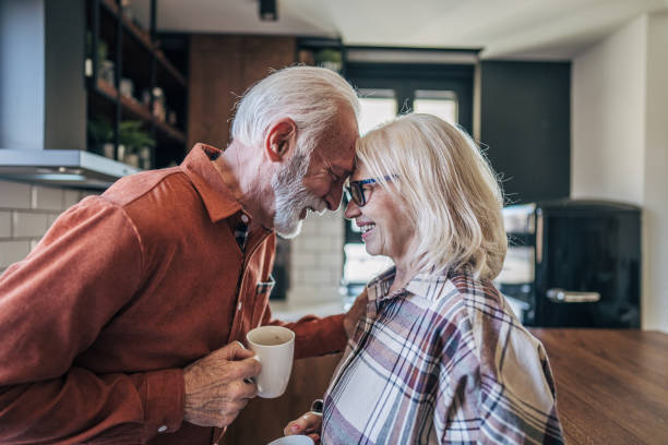 istock Elderly couple enjoying tea in the kitchen 2198007727