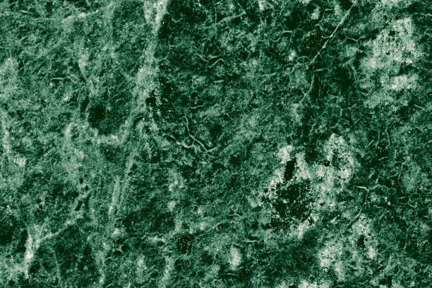 istock Real closeup of dark green marble stone texture surface background. Design pattern with high resolution for luxury home decoration. Abstract matt slab rock material. Front view of natural tiles stone surface. 2198007990