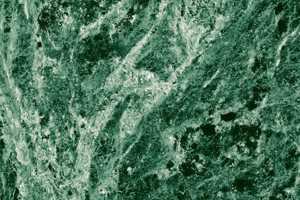 istock Real closeup of dark green marble stone texture surface background. Design pattern with high resolution for luxury home decoration. Abstract matt slab rock material. Front view of natural tiles stone surface. 2198008014