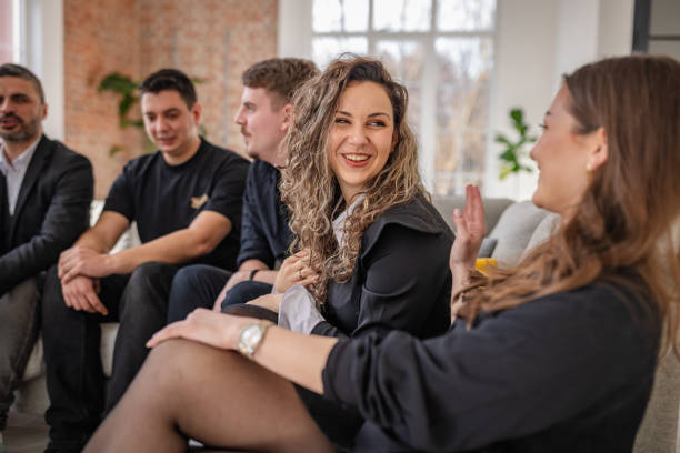 istock Adults enjoying a joyful moment in a cozy indoor setting with smiles and conversation among friends 2198008913
