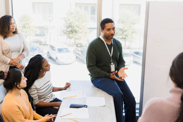 istock African American Male Therapist Leading Group Therapy Session 2198009027