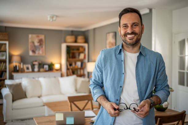 istock Portrait of a young modern man in a comfortable home office looking at the camera 2198009169