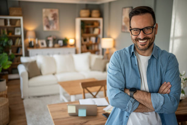 istock Portrait of a young modern man in a comfortable home office looking at the camera 2198009174