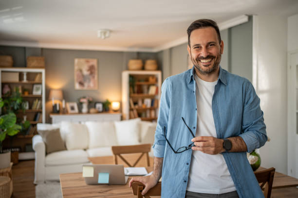 istock Portrait of a young modern man in a comfortable home office looking at the camera 2198009200