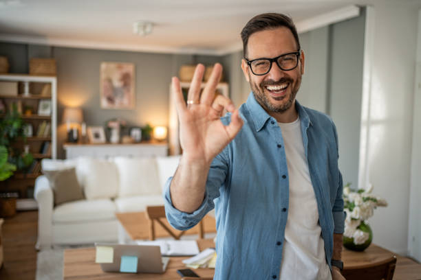 istock Portrait of a young modern man in a comfortable home office looking at the camera 2198009201
