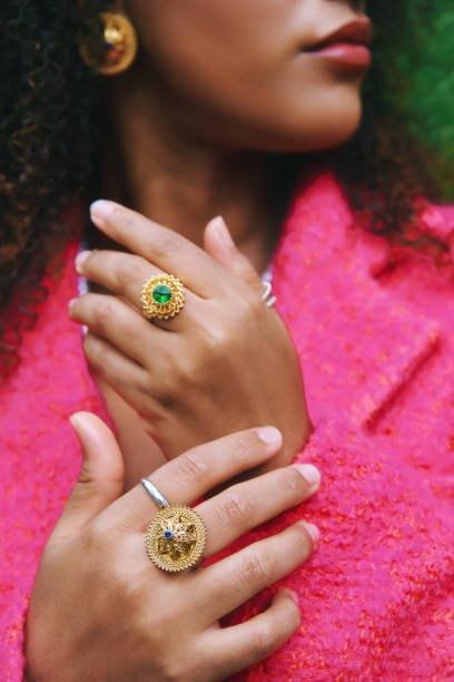 istock Close up image of female hands wearing golden rings with gemstones 2198009838
