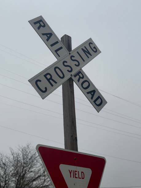istock Caution at the Crossroads: Railroad Crossing Sign 2198010311