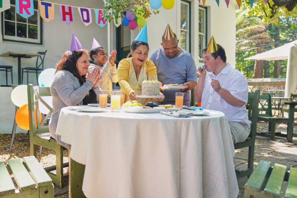 istock Disabled friends celebrating birthday 2198010455