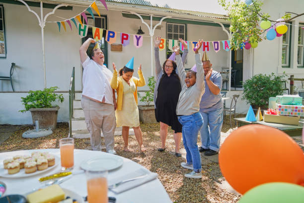 istock Disabled friends celebrating birthday 2198010522